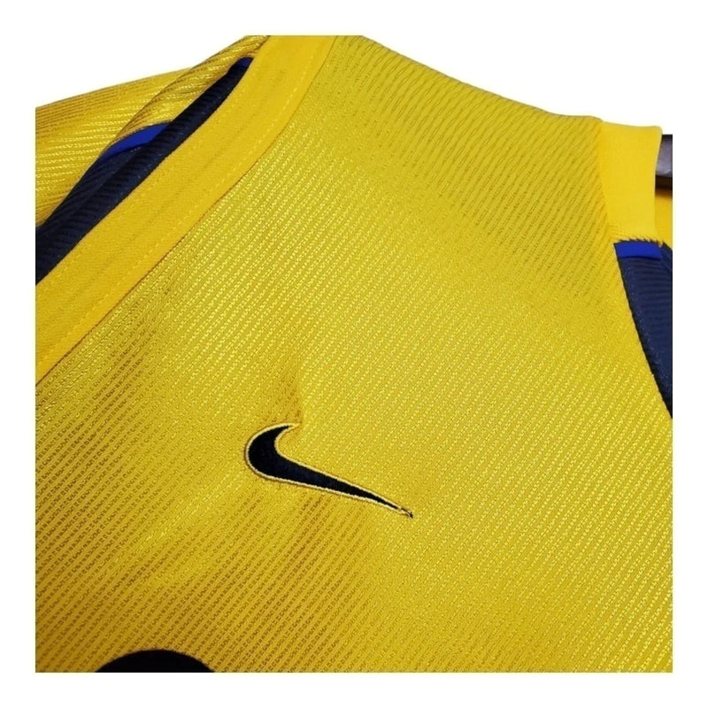 Arsenal II 99/00 - Masculina Nike - Amarela com detalhes em azul Camisa Retrô Arsenal II 99/00 - Masculina - Amarela com detalhes em azul